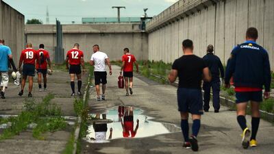 Players of 'La Drola' shown before a match at the Lorussa e Cutugno penitentiary. Gabriel Bouys / AFP