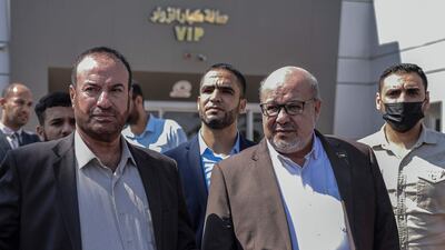 Hamas official Issam Al Daalis, front right, at the Rafah border crossing with Egypt in the southern Gaza Strip. A delegation from Gaza is travelling to Cairo for talks. Photo: AFP