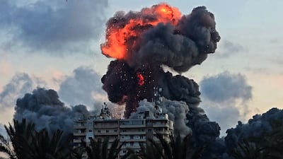 A fireball and smoke erupt from a building following an Israeli strike in Tyre. AFP