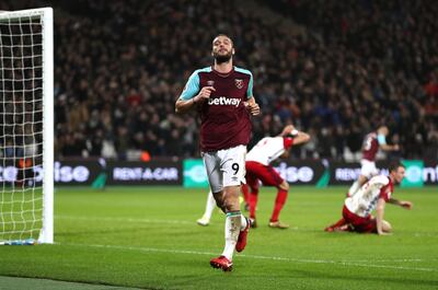 Andy Carroll will be West Ham United's attacking focal point at Huddersfield Town. Catherine Ivill / Getty Images