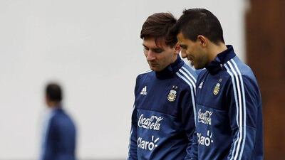 Argentina's Lionel Messi and Sergio Aguero talk during a training session on Monday ahead of the Copa America quarter-final round. Marcos Brindicci / Reuters