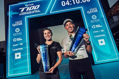 Britain's Kate Waugh, left, and Hayden Wilde of New Zealand celebrate their T100 world title wins in Qatar. Getty Images