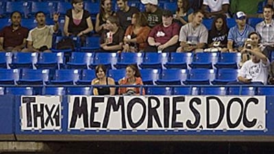 A sign in the bleachers thanks Roy Halladay for his contribution to the Blue Jays - but the pitcher said he may not be leaving.