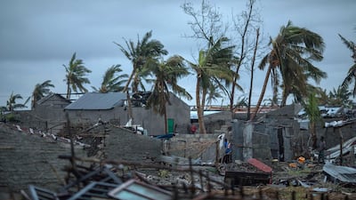 A handout photo made available by CARE, an international humanitarian agency shows local residents inspecting the damages after cyclone Idai made landfall in Sofala Province, Central Mozambique. A Category 4 Cyclone named Idai made land fall wreaking havoc knocking out power across the province and impacting every resident in Central Mozambique. EPA