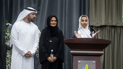 Social media influencer Salama Mohamed addresses guests as her husband, Khalid Al Ameri, and a guest look on