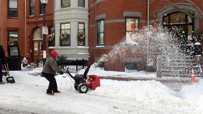 A man snow blows on East Concord Street in the South End after a two day winter storm in Boston, Massachusetts. Darren McCollester/Getty Images/AFP