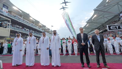 Sheikh Mohammed bin Rashid, Vice President and Ruler of Dubai (3rd R) and Sheikh Hazza bin Zayed, Vice Chairman of the Abu Dhabi Executive Council (4th R), stand for the UAE national anthem prior to the final race of the 2018 Formula 1 Etihad Airways Abu Dhabi Grand Prix. Seen with Jean Todt, President of the Federation International Automobile (FIA) (R), Chase Carey, Chairman & CEO of the Formula One Group (2nd R), Sheikh Hamdan bin Mohammed , Crown Prince of Dubai (5th R) and Sheikh Mansour bin Mohamed bin Rashid Al Maktoum (L). Ali Eissa / Dubai Media Office ---