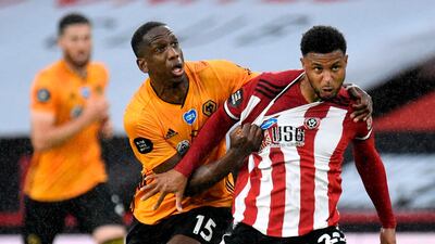 Wolverhampton Wanderers' Willy Boly, left, vies with Sheffield United's Lys Mousset. AFP