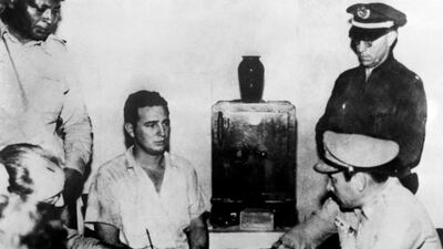 Fidel Castro gives his deposition to Colonel Chabiano, military chief of the Moncada Garrison, at the Vivac in Santiago de Cuba on July 26, 1953 after an attack on the Moncada garrison house by the group led by Castro. Archivo consejo de estado / AFP