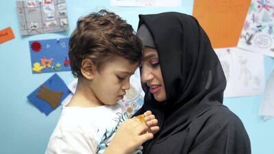 Zahia bin Zayed and her son 3-year-old Mohamed Hedi at the Dimensions Centre, which helps children with special needs. Chris Whiteoak / The National