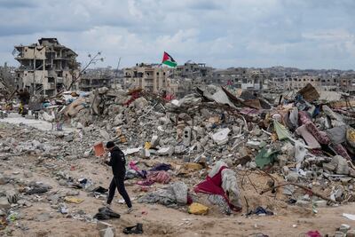 A man walks through the rubble of homes destroyed by Israel in Jabalia, northern Gaza. AP