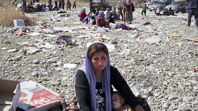 A Yezidi woman breaks down in tears after crossing from Syria back into Iraq. Sebastian Meyer / Corbis via Getty Images