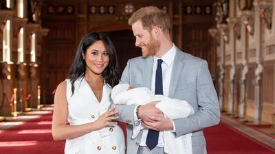 Britain's Prince Harry, Duke of Sussex, and his wife Meghan, Duchess of Sussex, pose for a photo with their newborn baby son Archie. AFP