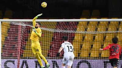 AC Milan goalkeeper Gianluigi Donnarumma tips a shot over the bar. AFP