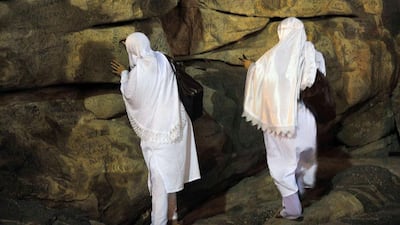 Pilgrims sign their names on rocks at Mount Arafat. Fayez Nureldine / AFP