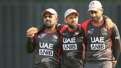 Rohan Mustafa, centre, top scored with 71 and also took two wickets in the UAE's victory over Oman. Courtesy ACC