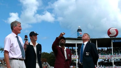 West Indies captain Brian Lara tosses the coin as England captain Michael Vaughan, Bob Willis and an officials look on in Antigua in 2004. Action Images