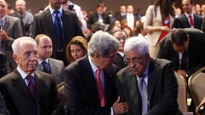 From right, Mahmoud Abbas, the Palestinian president, US secretary of state John Kerry and Israeli president Shimon Peres at a conference in Jordan in May. Salah Malkawi for The National