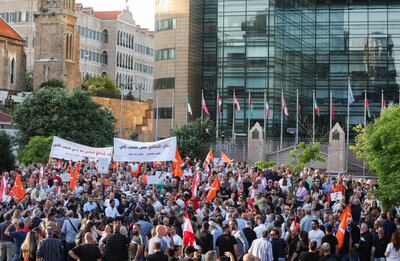 Demonstrators carry flags and banners during an anti-Syrian refugee rally organized by Lebanon's Free Patriotic Movement party in Beirut. Reuters