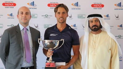 Winner Craig Hinton with Giuliano Gasparini of Aldar Properties and Mohammed Juma Buamaim, chairman of the Mena Golf Tour. Courtesy Mena Golf Tour