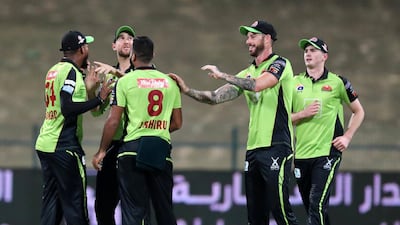 Qalandars celebrate after taking the wicket of Arabians' Dasun Shanaka. Chris Whiteoak / The National