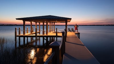 Walk along the pier, which begins in the backyard of Shaquille O’Neal’s Windermere mansion in Florida, all the way to a docking station built over Lake Butler, and you’ll spot the military-esque silhouette of a straight-backed man, head held high, arms akimbo, boots planted firmly apart, facing the water. Step closer, and the red cape with its unmistakable S logo – the Kryptonian symbol of hope – comes into focus: it’s a life-sized sculpture of Superman, the larger-than-life basketball player’s favourite superhero and one of his many monikers. Photos courtesy Toptenrealestatedeals.com