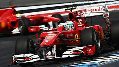 Fernando Alonso leads Felipe Massa during the closing stages of the German Grand Prix after overtaking his Brazilian teammate under team orders.
