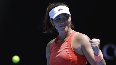 Garbine Muguruza of Spain celebrates after defeating Anett Kontaveit of Estonia in their first round match at the Australian Open tennis championships in Melbourne, Australia, Tuesday, Jan. 19, 2016.(AP Photo/Aaron Favila)