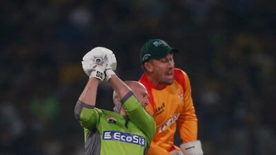 Ben Dunk is caught behind by Islamabad United wicketkeeper Luke Ronchi. AP Photo