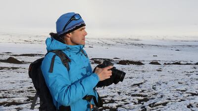 Photo by Manu San Félix / National Geographic. National Geographic Explorer-in-Residence and Expedition Leader Enric Sala observes his surroundings during a Pristine Seas expedition in Franz Josef Land.