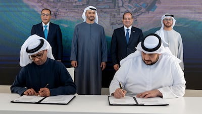 President Sheikh Mohamed, standing centre left, and Egypt's President Abdel Fattah El Sisi, centre right, at the signing of the agreement. Photo: UAE Presidential Court