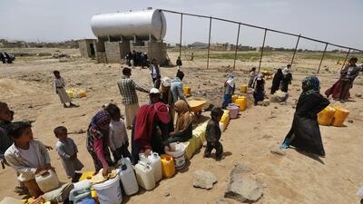 As the war rages on, Yemenis queue for water in Sanaa,. (Yahya Arhab / EPA)