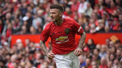 Beckham looks on during the game. Getty