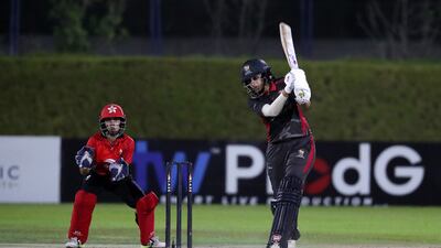 Esha Oza of UAE plays a shot.