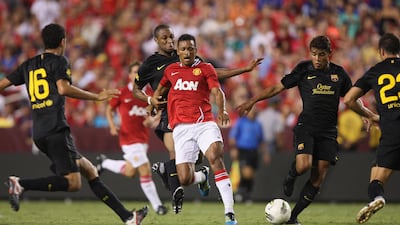 In this file photo from July 30, 2011 Nani of Manchester United, centre, clashes with Seydou Keita and Jonathan dos Santos of Barcelona during the pre-season friendly match at FedExField on July 30, 2011 in Landover, Maryland. Peters / Getty Images)
