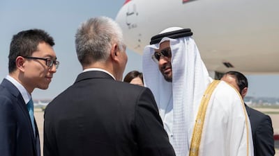 Sheikh Mohamed bin Zayed is greeted by Chinese officials upon his arrival to Beijing on Sunday. Rashed Al Mansoori / Ministry of Presidential Affairs