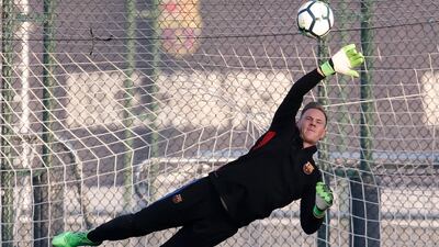 Barcelona goalkeeper Marc-Andre Ter Stegen makes a save during the training session. Pau Barrena / AFP