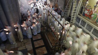 Latin clergymen in procession on Thursday during the Catholic Washing of the Feet ceremony in Easter holy week, next to the tomb of Jesus at the Church of the Holy Sepulchre in the Old City of Jerusalem. EPA