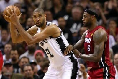 Tim Duncan, left, being guarded by LeBron James, is the San Antonio Spurs' most recent great big man. AFP