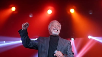Dressed in a dapper grey suit, Tom Jones and his 10-piece band played a number of hits yesterday. Sammy Dallal / The National