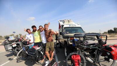 From left: Matthias Schurch from Switzerland, Ivan Zaikov from Bulgaria, Cyril Chauvet from France, and Leonard Benno from Germany took a break from their world journeys at the Dubai Travellers Festival in Dubai. Satish Kumar / The National