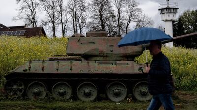 A visitor pass by a T-34 battle tank at former east German-west German borderline, part of German museum in Moedlareuth, Germany. EPA