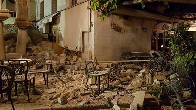 A cafe setting is littered with rubble following a strong earthquake on the Greek island of Kos early Friday, July 21, 2017. A powerful earthquake struck Turkey's Aegean coast and nearby Greek islands, sending frightened residents running out of buildings they feared would collapse and into the streets. (Sander van Deventer via AP)