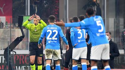 Referee Davide Massa gestures after the VAR review to disallow the goal scored by Franck Kessie. Reuters