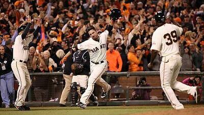 San Francisco Giants' Travis Ishikawa approaches home plate after hitting a three-run home run in the ninth inning against the St. Louis Cardinals in Game 5 of baseball's NL Championship Series, Thursday, Oct. 16, 2014, in San Francisco. The Giants won 6-3, and advanced to the World Series. AP Photo/St. Louis Post-Dispatch, Chris Lee