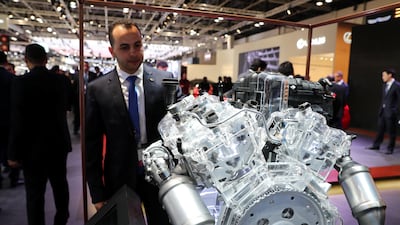 A visitor looks at a Hyundai Lambda engine. Chris Whiteoak / The National