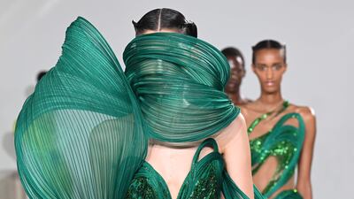 Models present creations a creation by Gaurav Gupta at the Fashion Week show in Paris. AFP