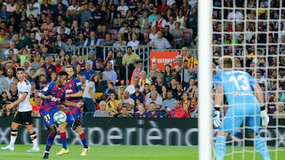 Barcelona´s Guinea-Bissau forward Ansu Fati controls the ball in front of Valencia's Dutch goalkeeper Jasper Cillessen. AFP