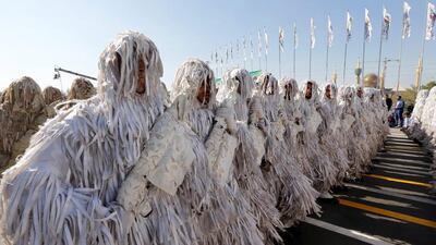 Camouflaged Iranian soldiers march during the annual military parade marking the beginning of the 1980-1988 war with Iraq, in Tehran. Abedin Taherkenareh / EPA