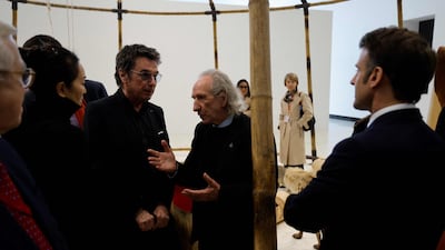 From left, actress Gong Li, musician Jean Michel Jarre, French history expert Patrice Fava and the French President during their visit to the Red Brick Museum in Beijing. AFP